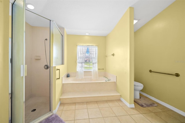 bathroom with plus walk in shower, tile patterned flooring, and toilet