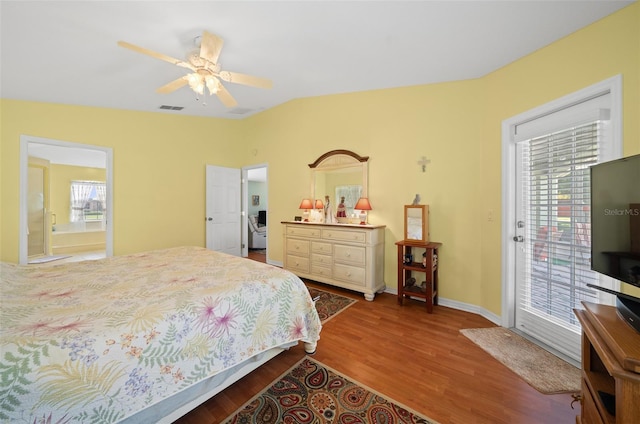 bedroom featuring multiple windows, ceiling fan, hardwood / wood-style flooring, and access to outside