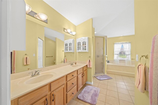 full bathroom featuring vanity, tile patterned flooring, toilet, plus walk in shower, and lofted ceiling