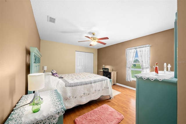 bedroom featuring a closet, ceiling fan, and wood-type flooring