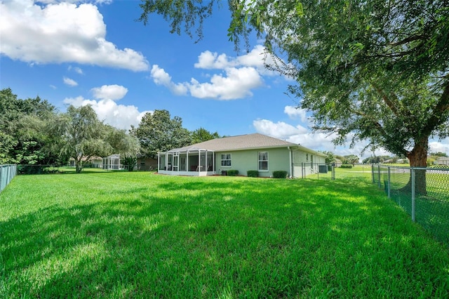 view of yard featuring a sunroom