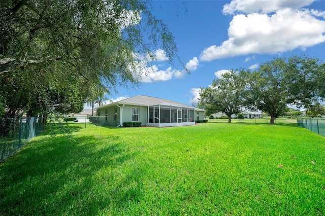 view of yard featuring a sunroom