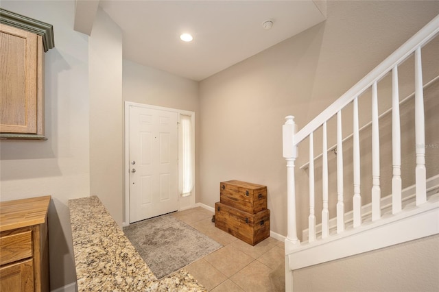 entrance foyer featuring light tile patterned floors