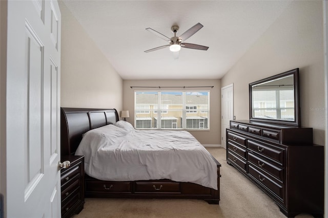 bedroom featuring carpet, a closet, vaulted ceiling, and ceiling fan