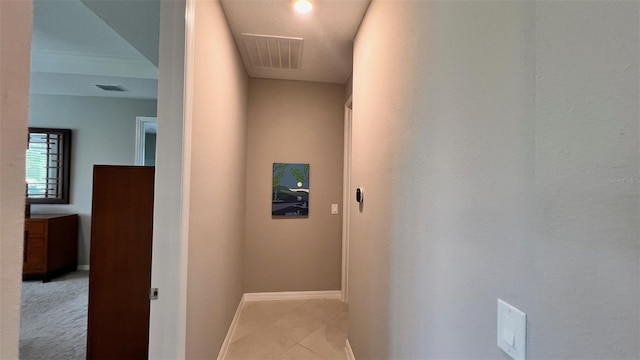 corridor featuring light tile patterned floors