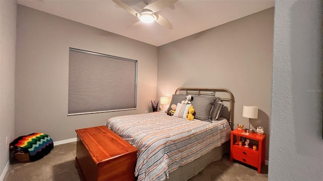 bedroom featuring ceiling fan and carpet