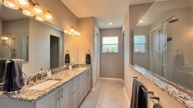 bathroom with vanity, an enclosed shower, and tile patterned floors