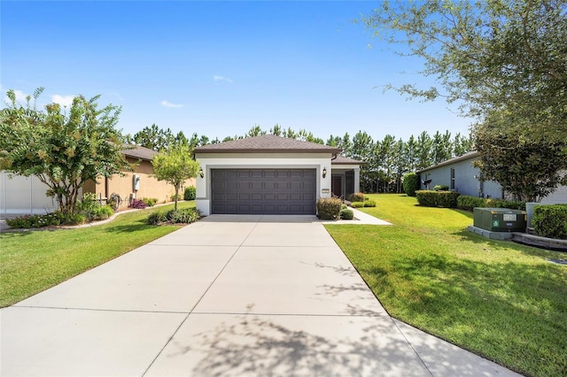 view of front facade with a garage and a front lawn