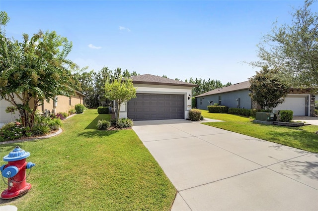 view of front of home featuring a garage and a front lawn