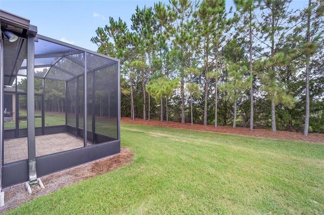 view of yard featuring glass enclosure