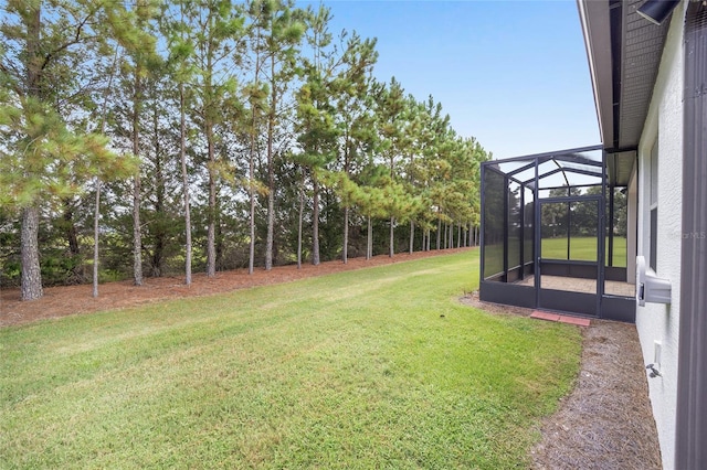 view of yard featuring glass enclosure