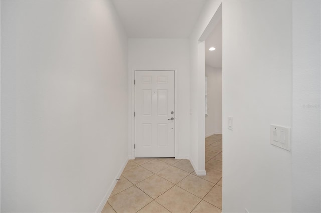 corridor with light tile patterned floors