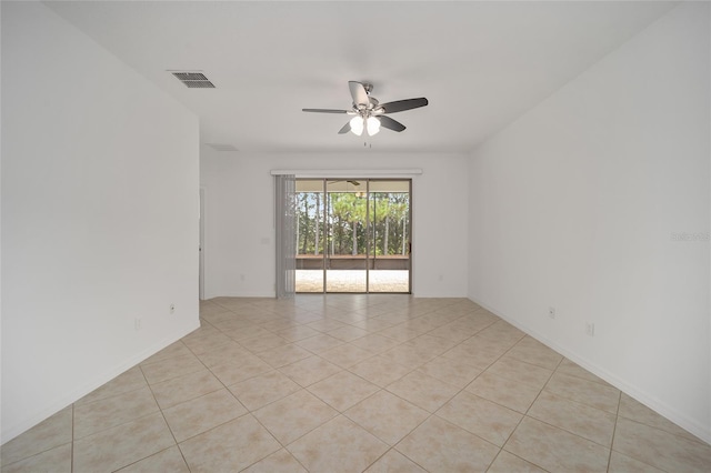 unfurnished room with light tile patterned floors and ceiling fan