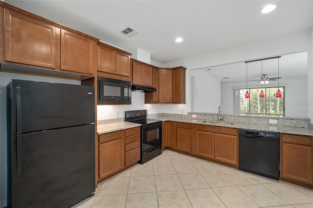 kitchen featuring light stone counters, sink, black appliances, extractor fan, and ceiling fan