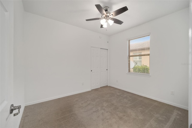 empty room with carpet and ceiling fan