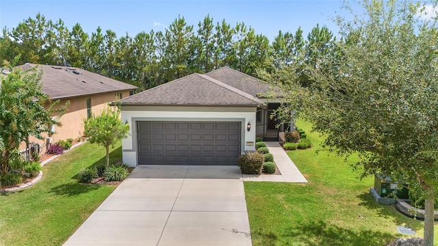 view of front of property with a garage and a front lawn