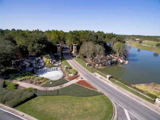 birds eye view of property with a water view