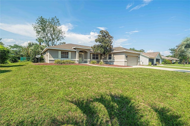 ranch-style home featuring a garage and a front lawn