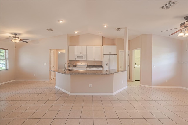 kitchen with vaulted ceiling, ceiling fan, white appliances, and white cabinetry