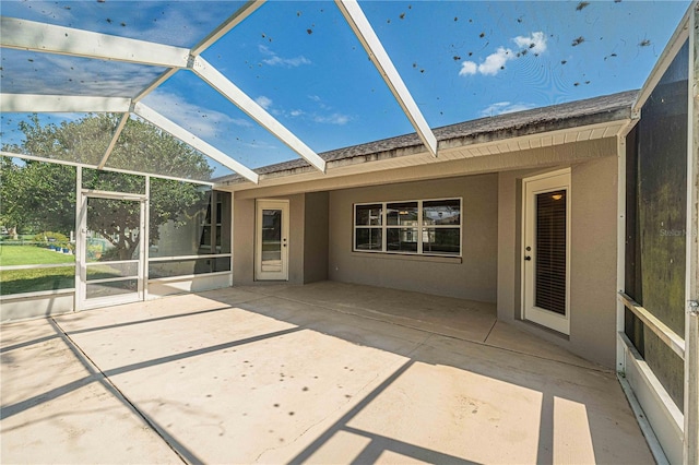 view of patio with a lanai