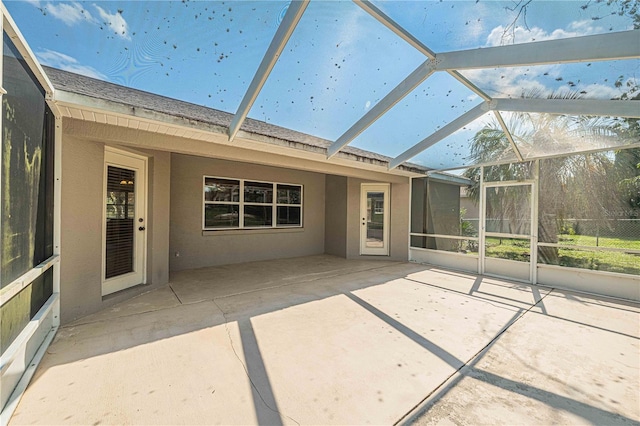 unfurnished sunroom featuring lofted ceiling