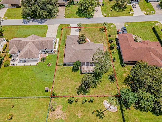 birds eye view of property with a residential view