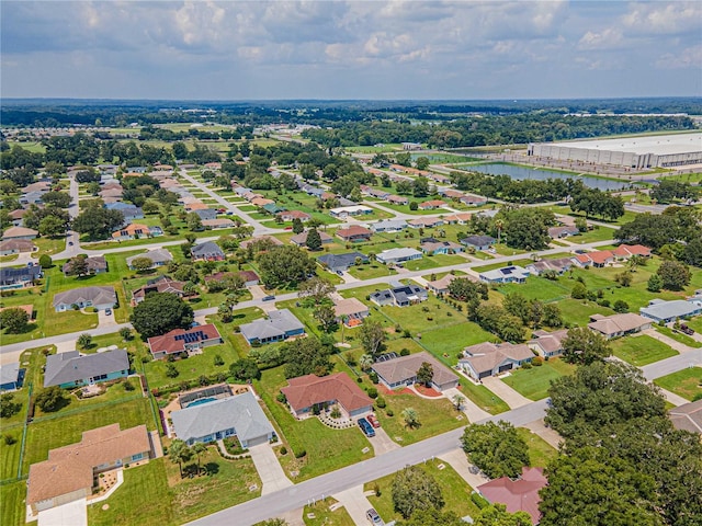 bird's eye view featuring a water view and a residential view