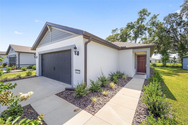 single story home with a front yard and a garage