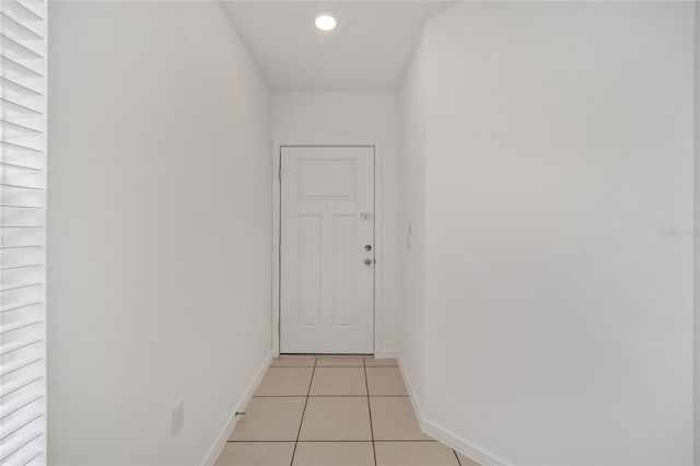 hallway featuring light tile patterned floors