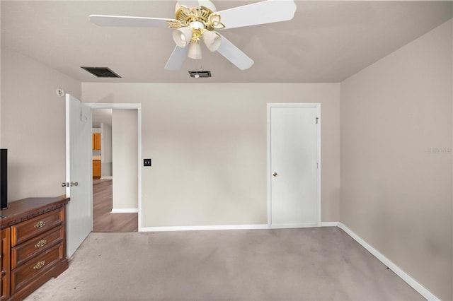 unfurnished bedroom with carpet flooring and ceiling fan