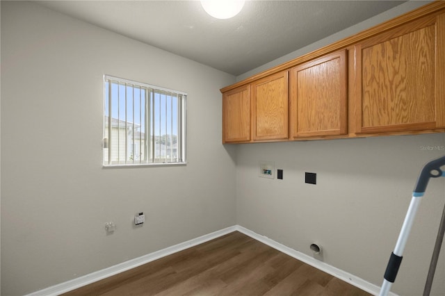 laundry room featuring cabinets, washer hookup, and dark hardwood / wood-style flooring