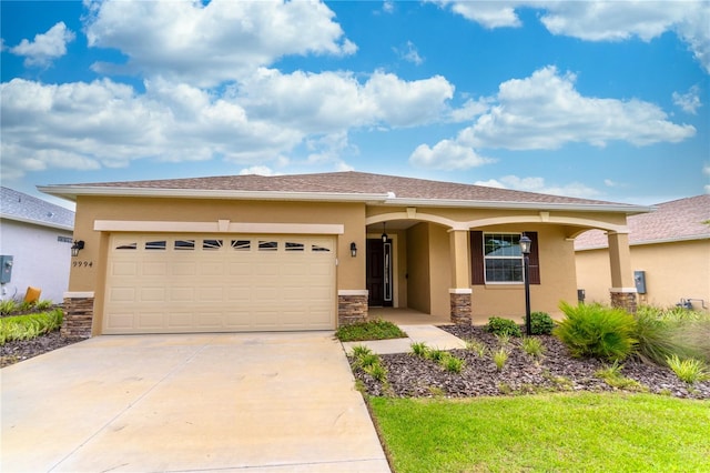 view of front of house featuring a garage, stone siding, concrete driveway, and stucco siding