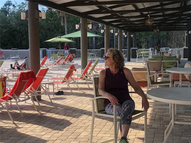 view of home's community with a patio area