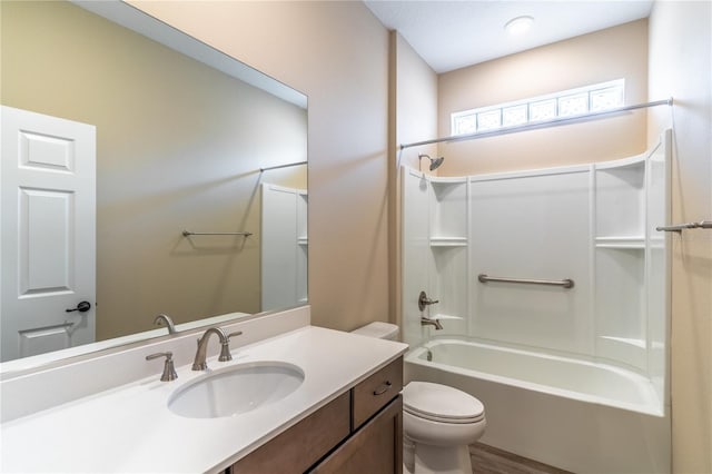 full bathroom with toilet, vanity, and shower / bathtub combination