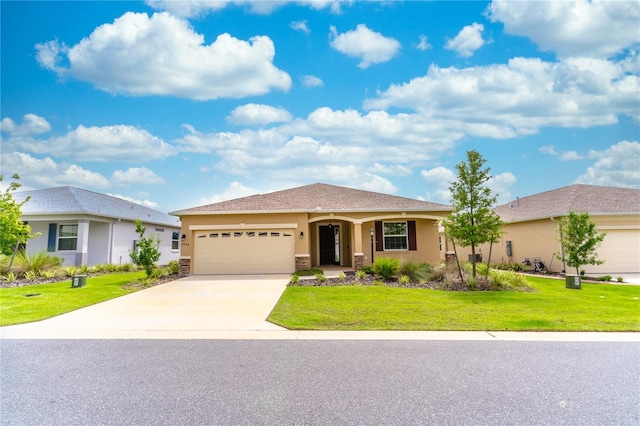 ranch-style home with driveway, a front lawn, an attached garage, and stucco siding