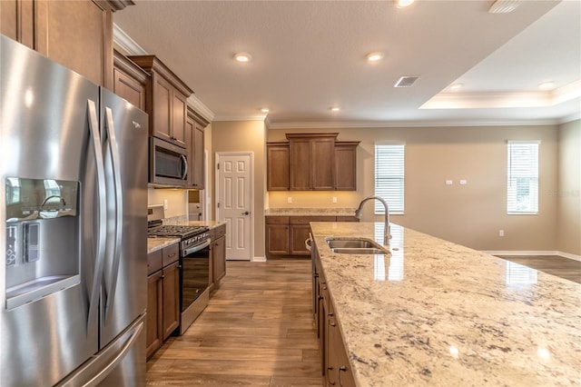 9994 SW 96th St, Ocala, FL 34481 - kitchen featuring crown molding, appliances with stainless steel finishes, wood finished floors, and a sink