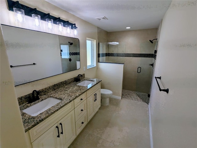 bathroom with vanity, toilet, an enclosed shower, and a textured ceiling