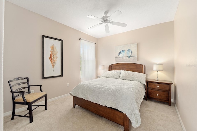 bedroom featuring light carpet and ceiling fan