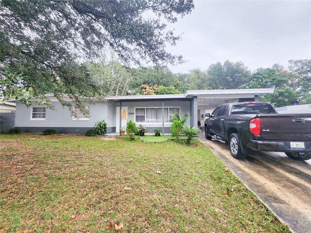 ranch-style house featuring a front lawn