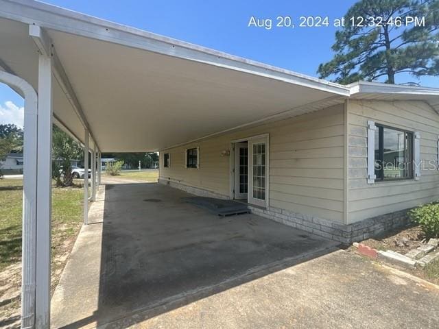 view of vehicle parking with a carport