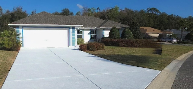 ranch-style house with a garage and a front lawn