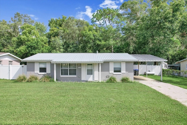 ranch-style home featuring a front yard and a carport