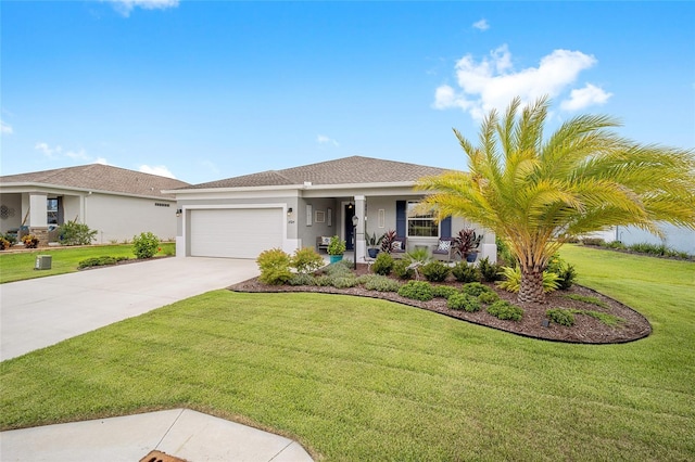 view of front of property featuring a garage and a front yard