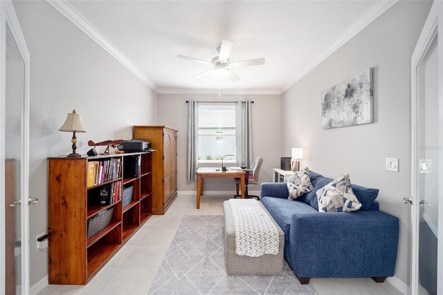 sitting room featuring ornamental molding, light tile patterned flooring, a ceiling fan, and baseboards