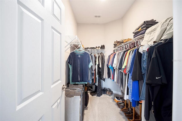 walk in closet featuring carpet flooring and visible vents