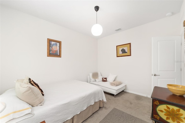 bedroom featuring light carpet