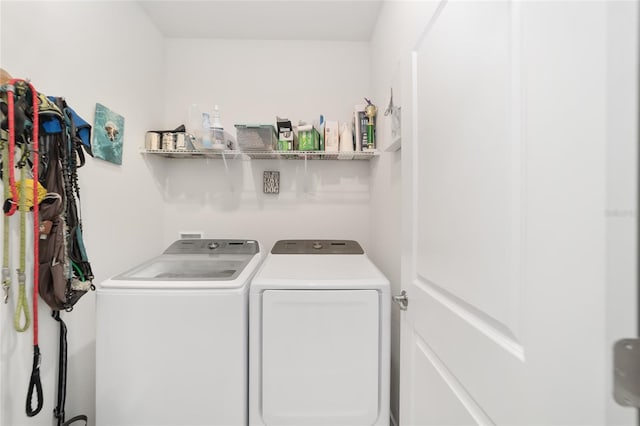 laundry room with independent washer and dryer