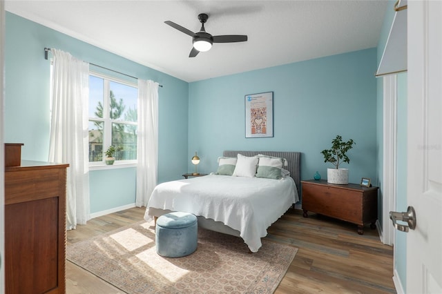 bedroom featuring ceiling fan and hardwood / wood-style floors