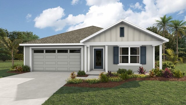 view of front of house featuring a garage and a front yard