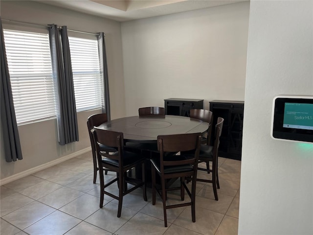 dining room featuring light tile patterned floors